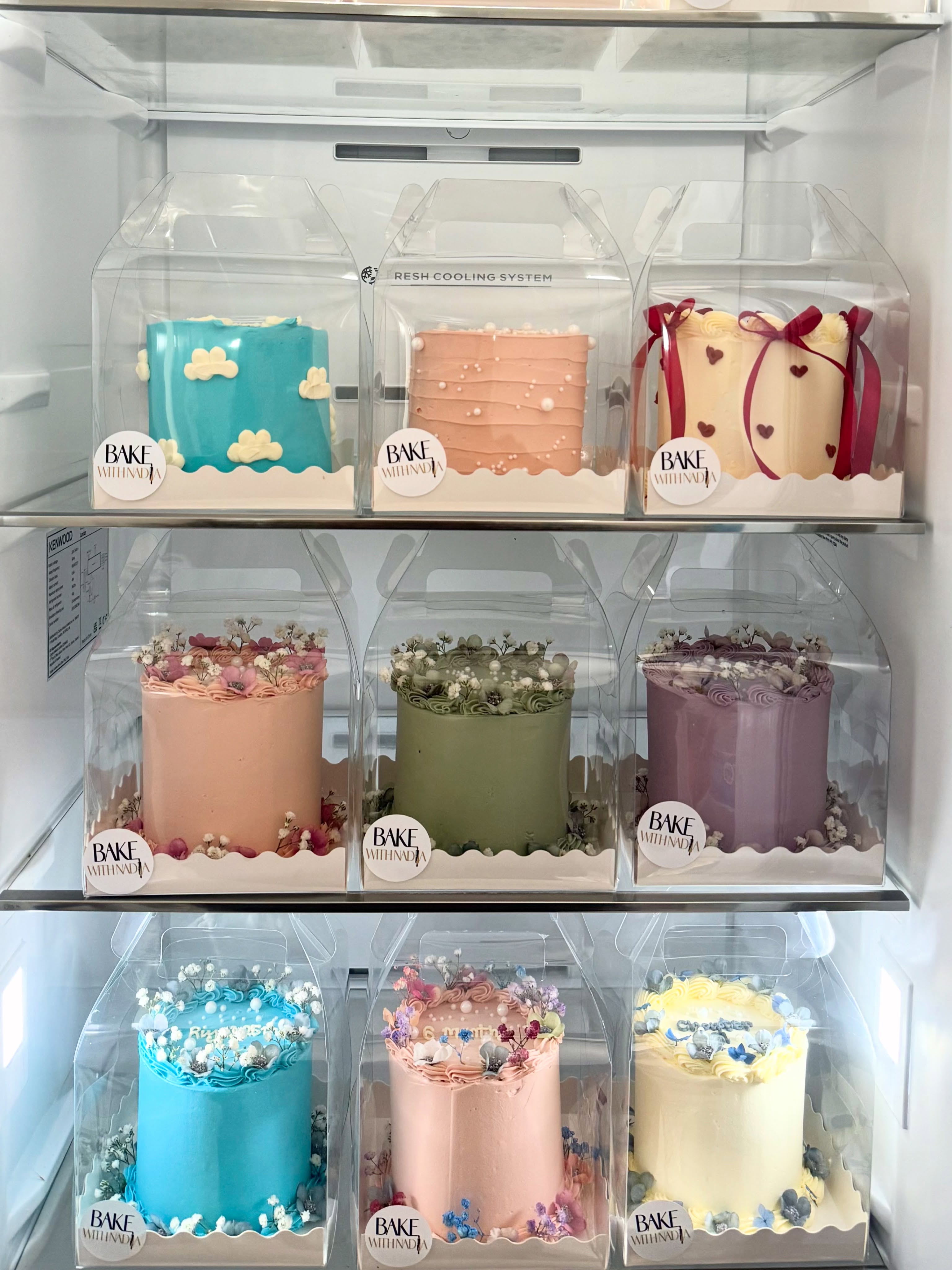 A display of boxed cakes in many colours