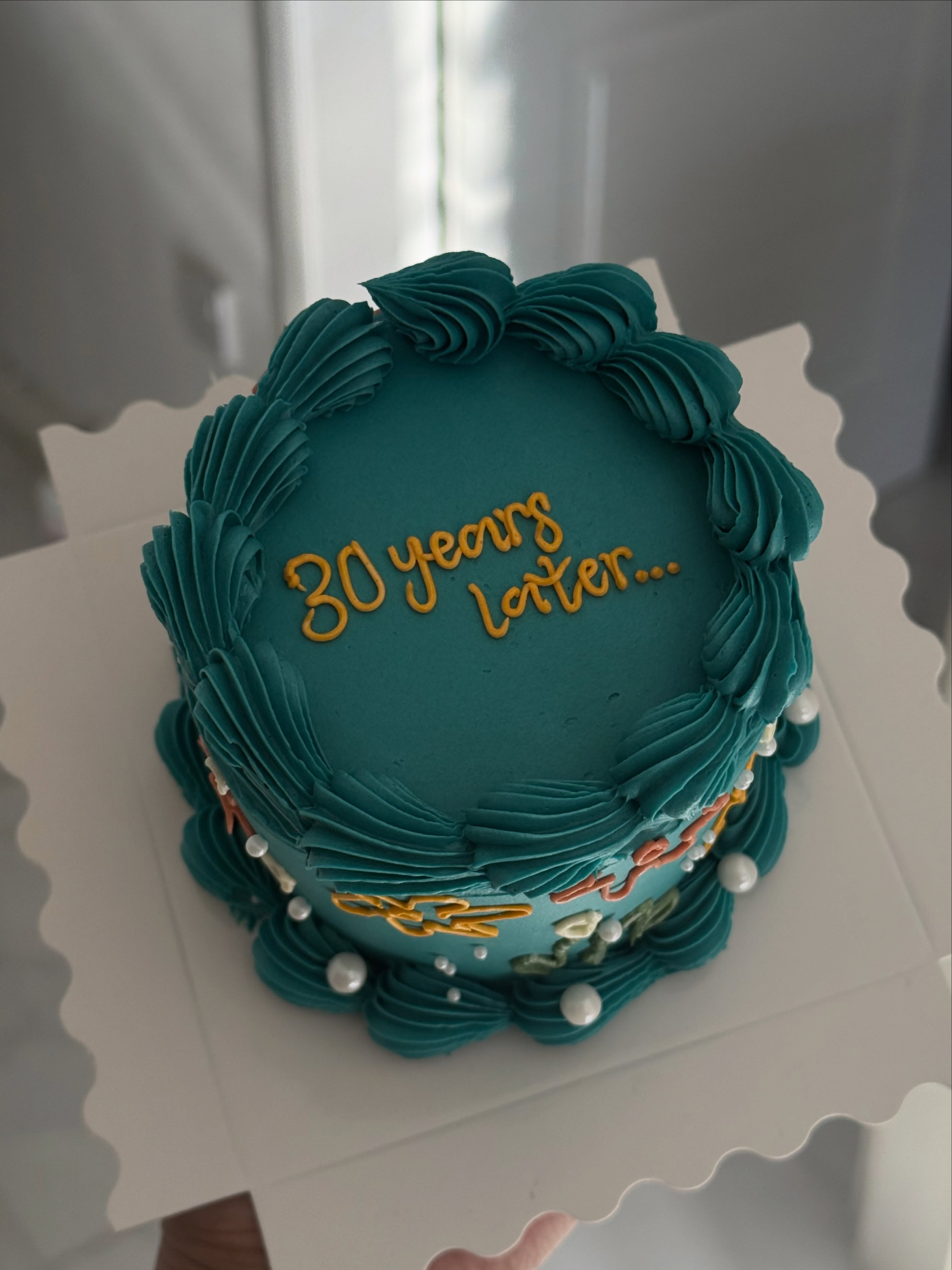 Deep teal vintage heart cake with gold script